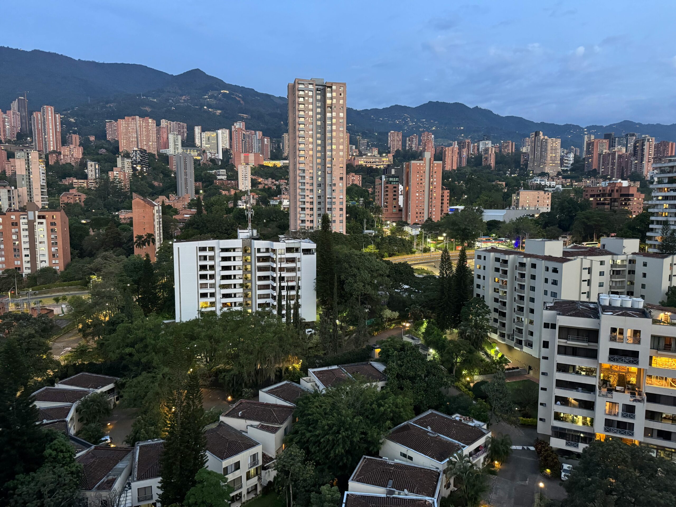 A captivating view of the Medellín skyline at sunrise, showcasing the city's urban and natural landscapes.